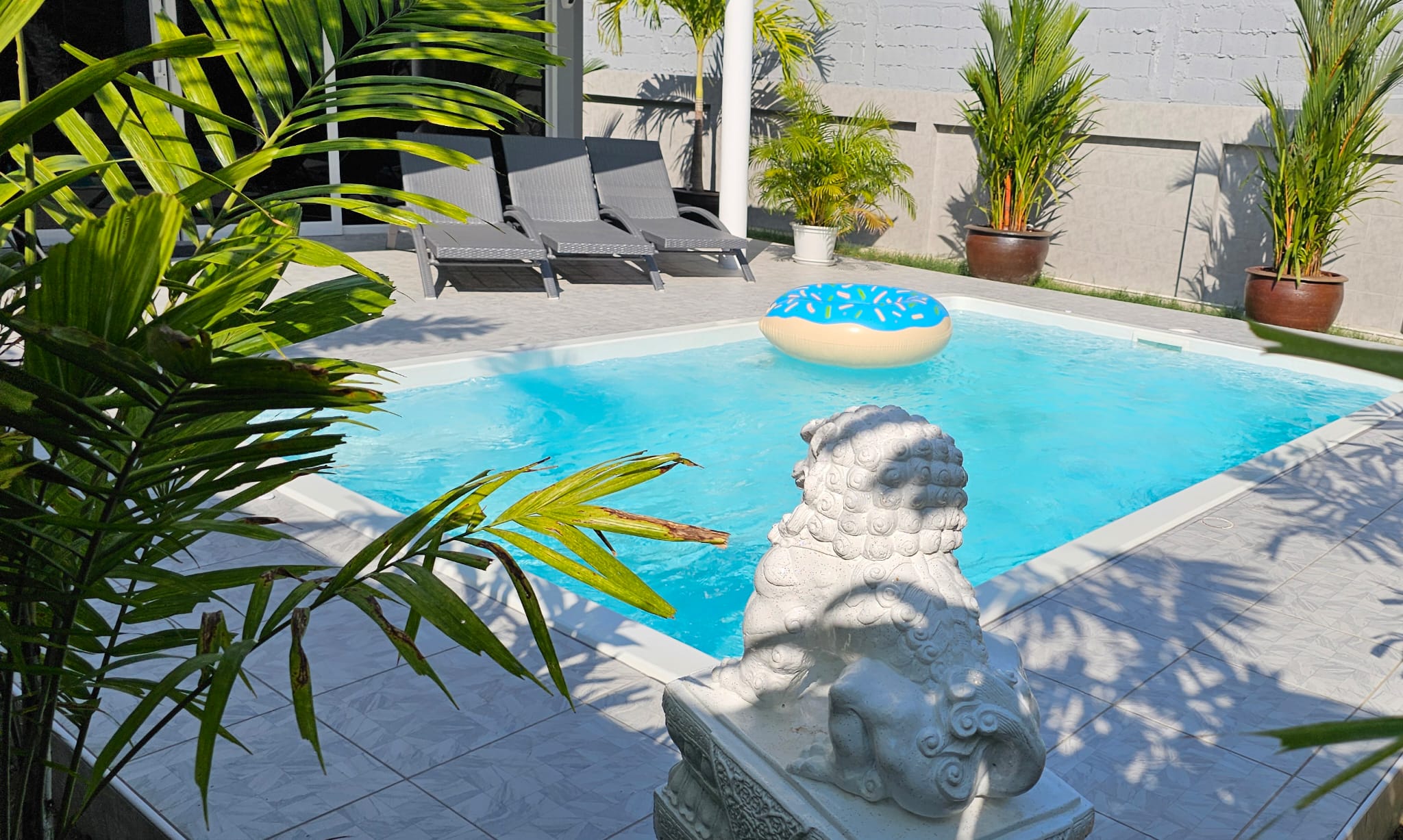 Pool and garden statue at the villa